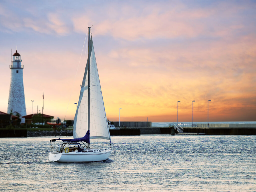 sailboat leaving marina