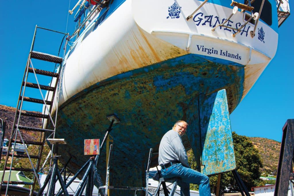 Preparing a sailboat for bottom paint.