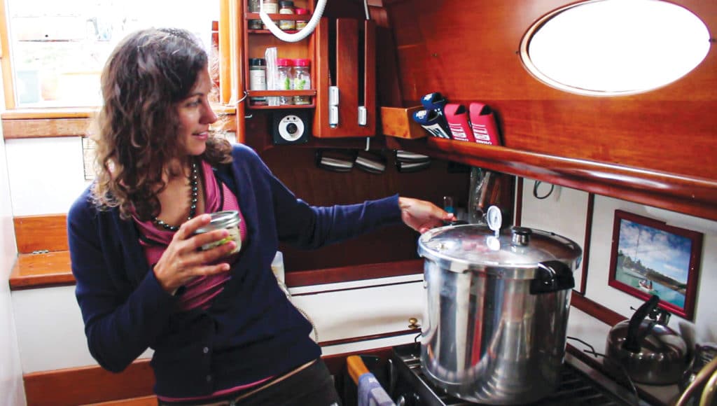 Canning fish aboard a boat with a pressure cooker.