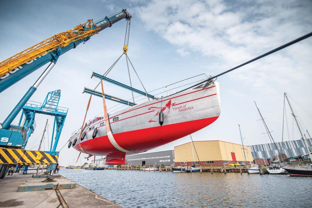 77-foot sailboat hoisted into the air.