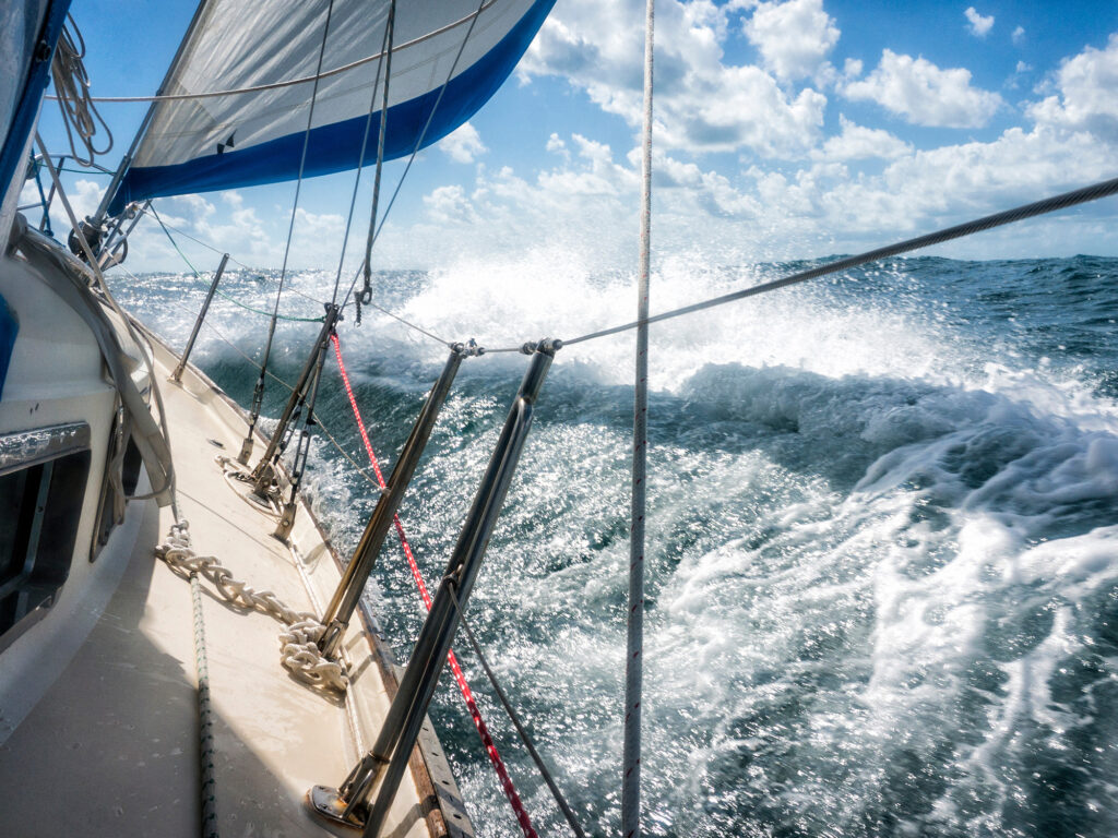 Rough seas during sailing crossing large crashing waves seasick