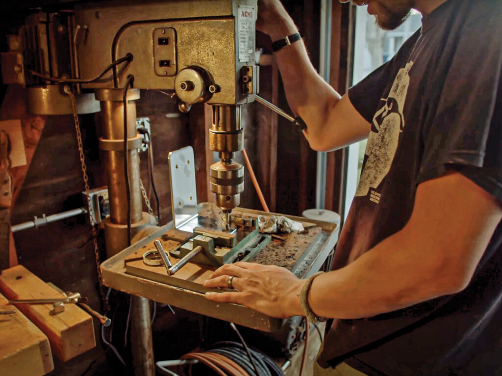 person using drill press