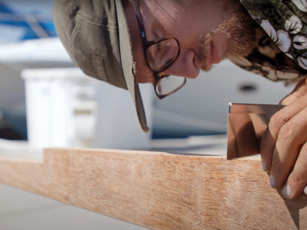 person using a Japanese handsaw